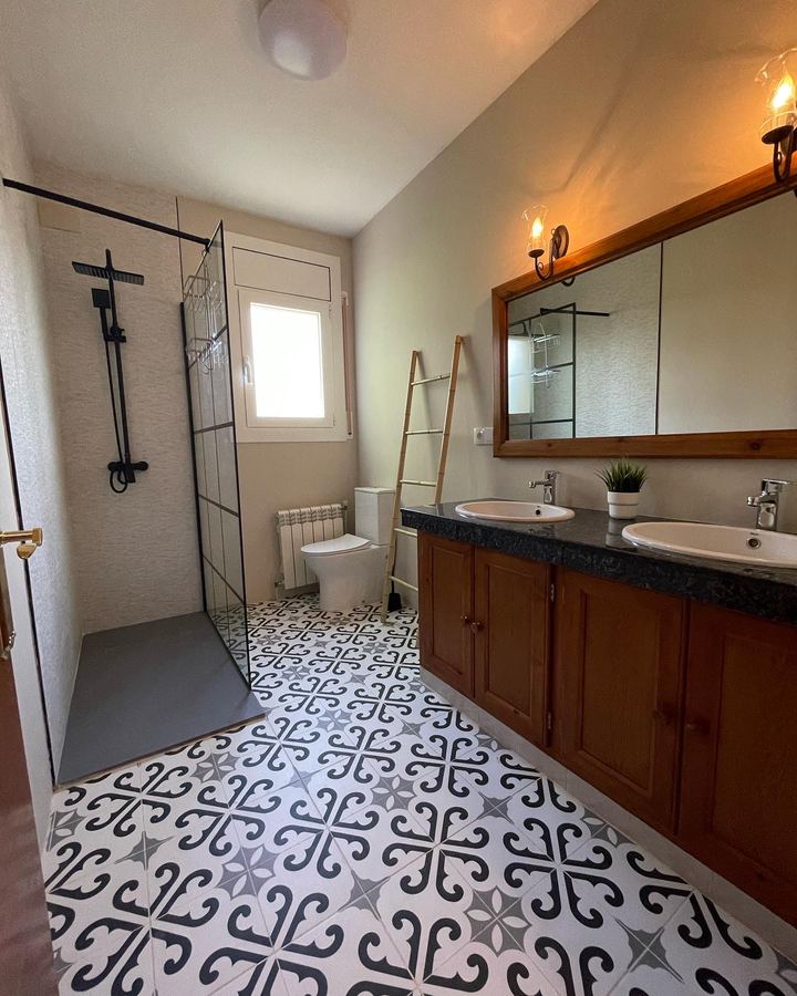 Bathroom with walk-in shower and double basin