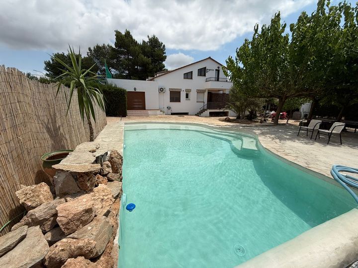 Outdoor pool with the house behind
